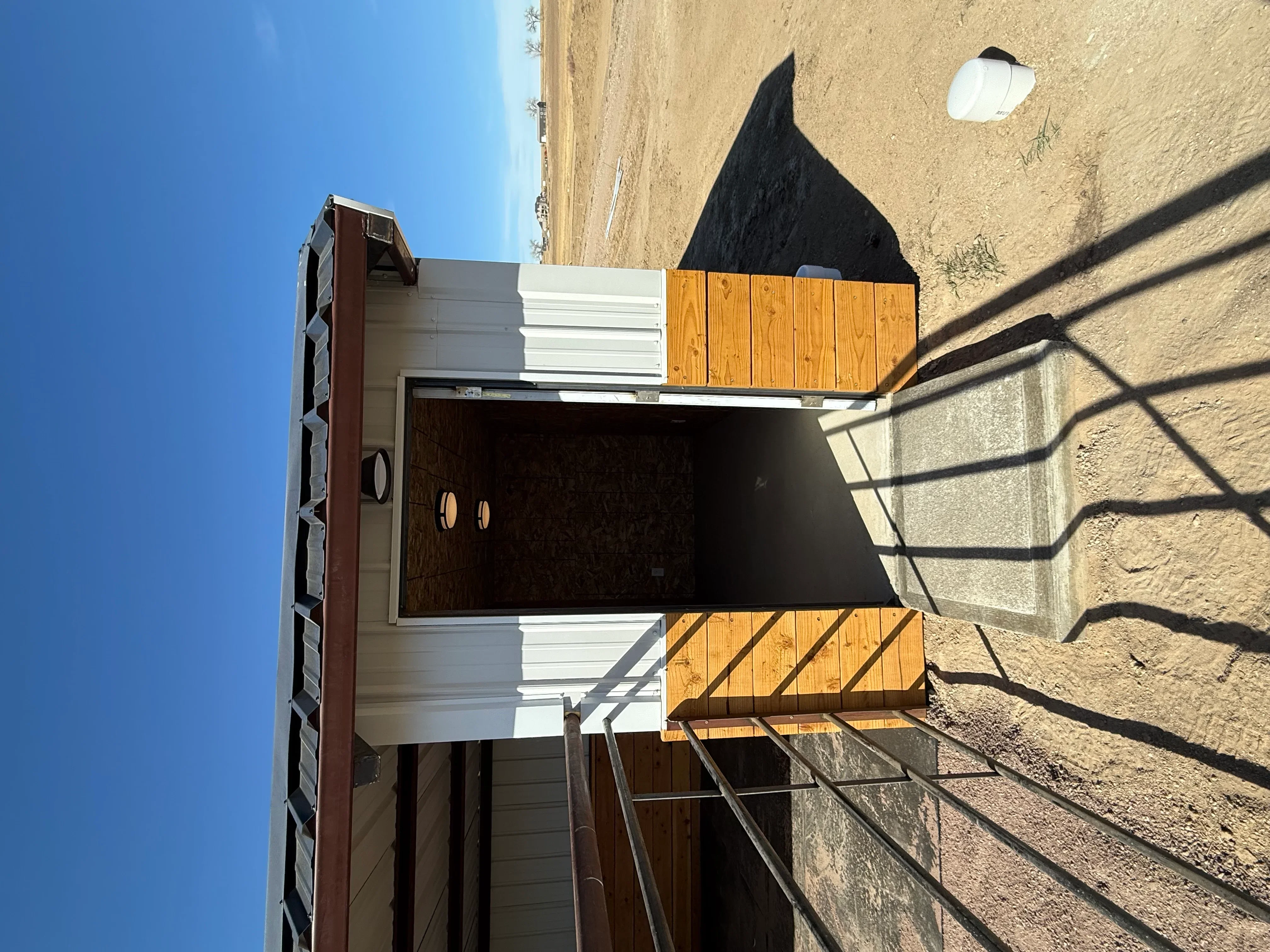 Metal roof with standing seam and mixed siding panels installed on building structure